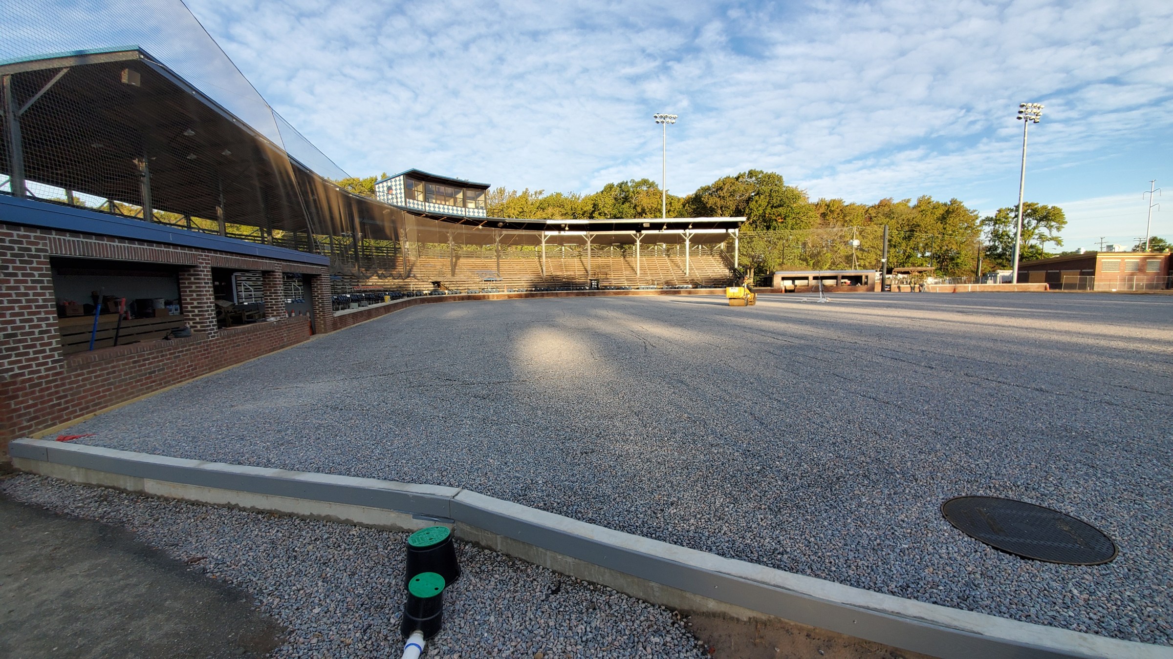 Prepared stone base and drainage structures before the artificial turf is installed.