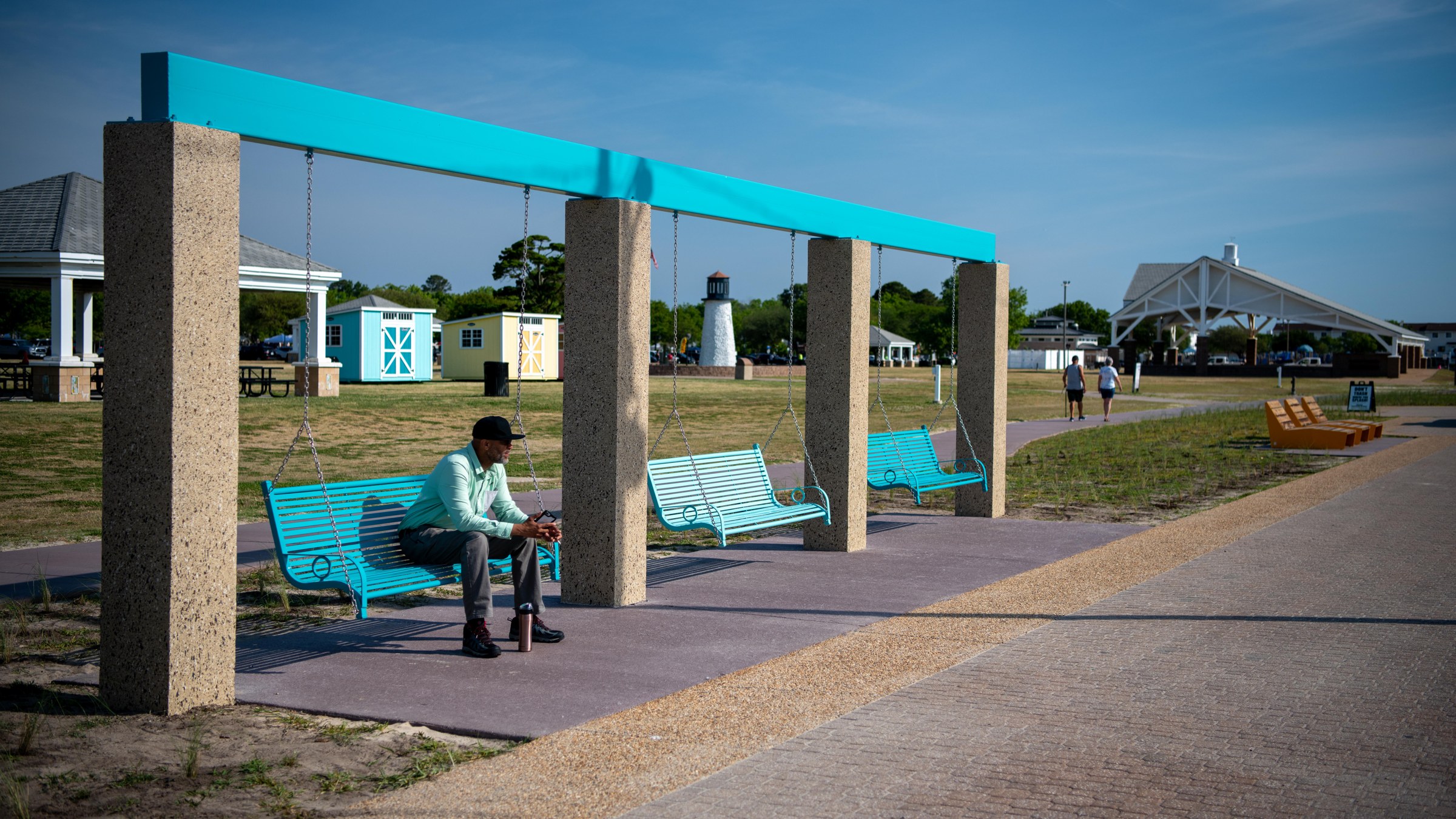 Swing seating and coated support columns add a distinct waterfront amenity.